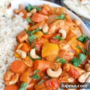 Effortless Slow Cooker Chicken Curry 6 Slow Cooker Chicken Curry in a white bowl, ready to eat.