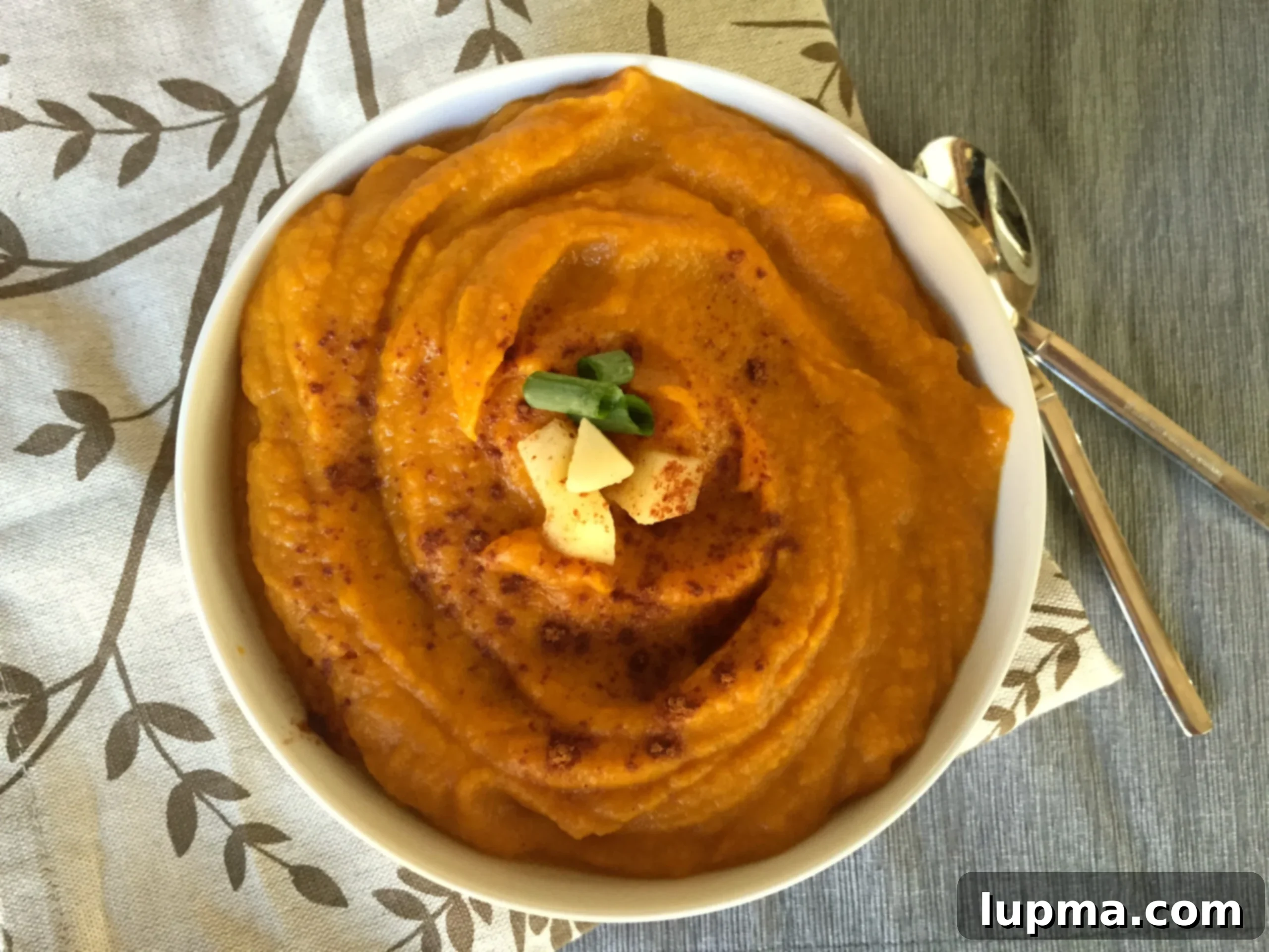 Comforting Butternut Squash Sweet Potato Apple Soup 4 Close-up of Butternut Squash Sweet Potato Apple Soup with garnishes.