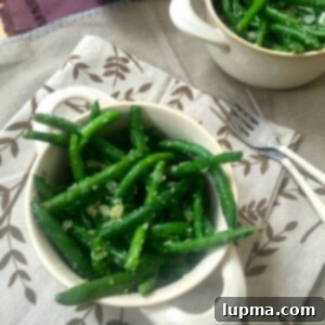 Effortless Garlic Parmesan Green Beans 5 Delicious Simple Garlic Parmesan Green Beans on a plate.