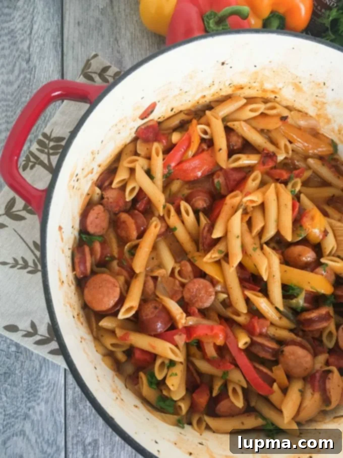 Spicy Cajun One-Pot Wonder 2 One Pot Cajun Pasta - A vibrant, creamy pasta dish with sausage and bell peppers.