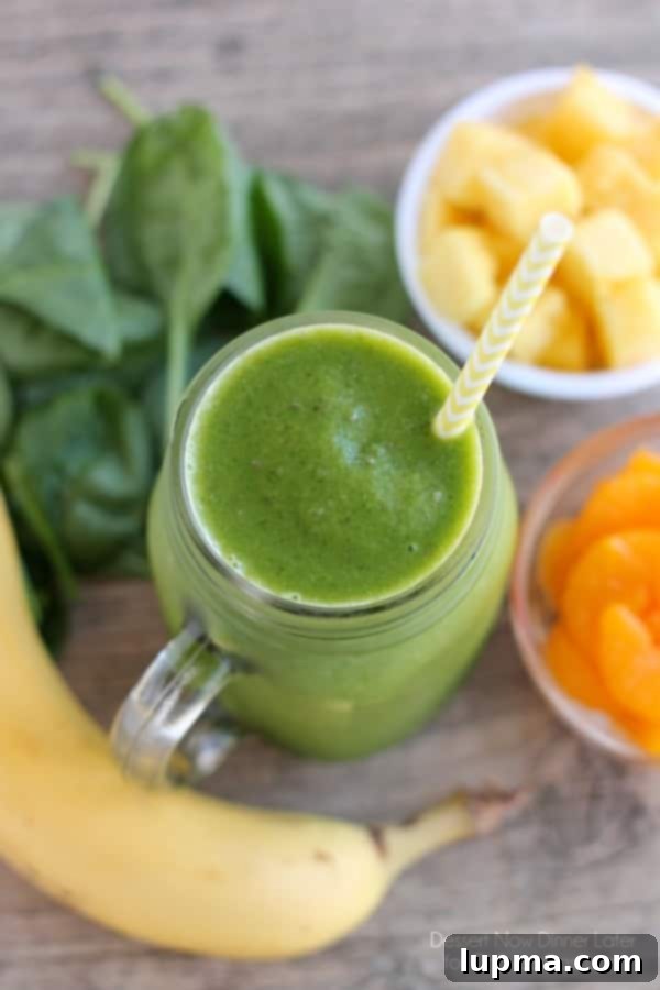 11 Irresistibly Refreshing Smoothies 12 A bright green Pineapple Orange Banana Green Smoothie in a glass jar.