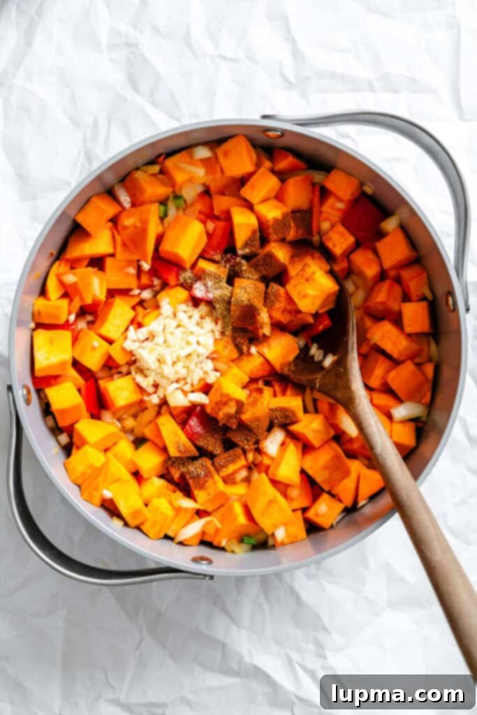 Hearty Sweet Potato Chili 7 Sweet Potato Chili sweet potatoes and spices in pot