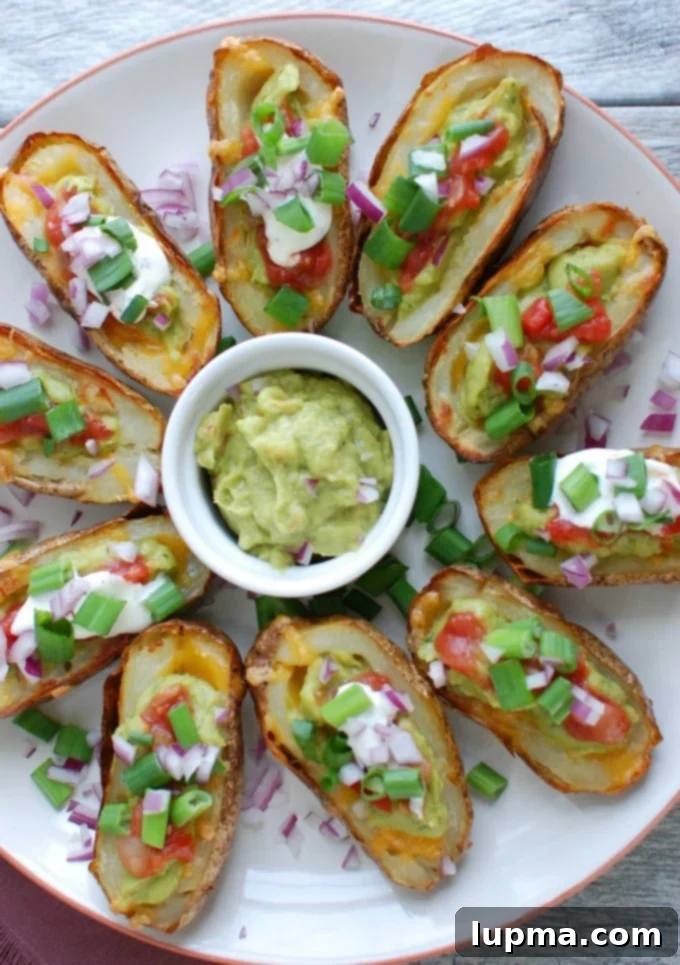 Zesty Guacamole Potato Skins 4 Serving platter with multiple Guacamole Stuffed Potato Skins, ready to eat.