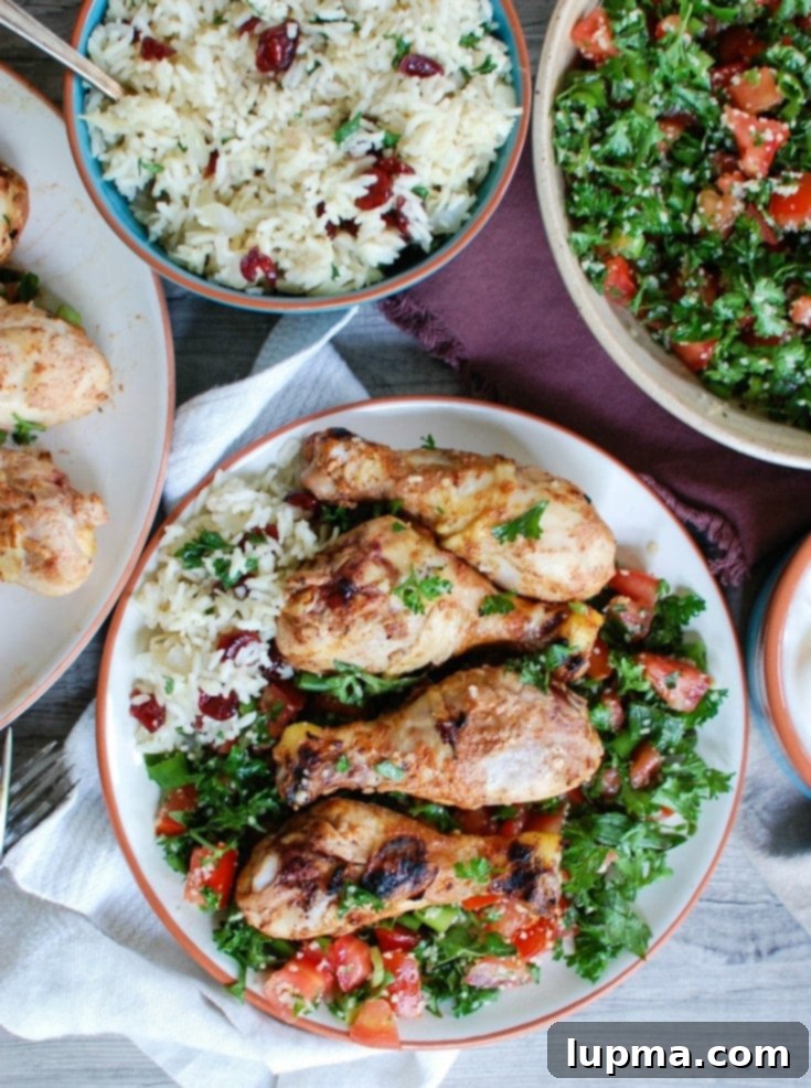 Herbed Mediterranean Chicken with Basmati Rice 3 Marinated Mediterranean chicken drumsticks in a bowl, showing the rich yogurt and spice coating before grilling, promising juicy flavor.