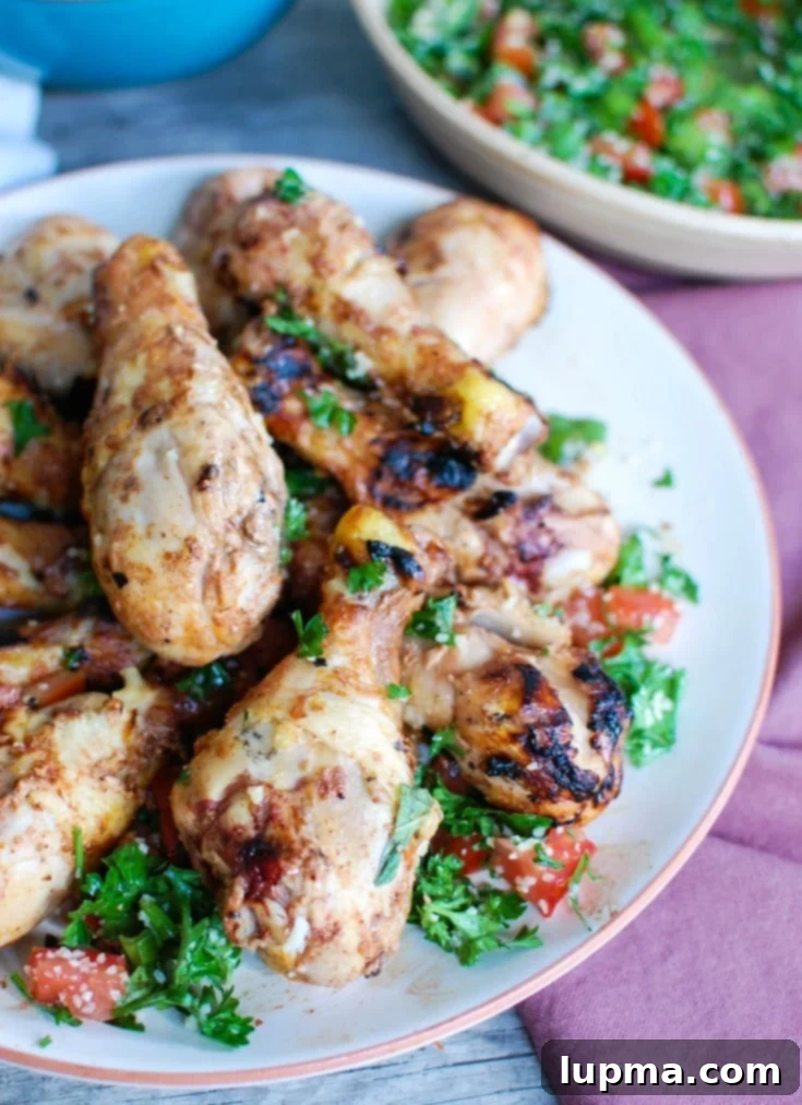 Herbed Mediterranean Chicken with Basmati Rice 5 A vibrant platter of Mediterranean Chicken with Basmati Rice and fresh tabbouleh, showcasing a balanced and flavorful weeknight meal option.