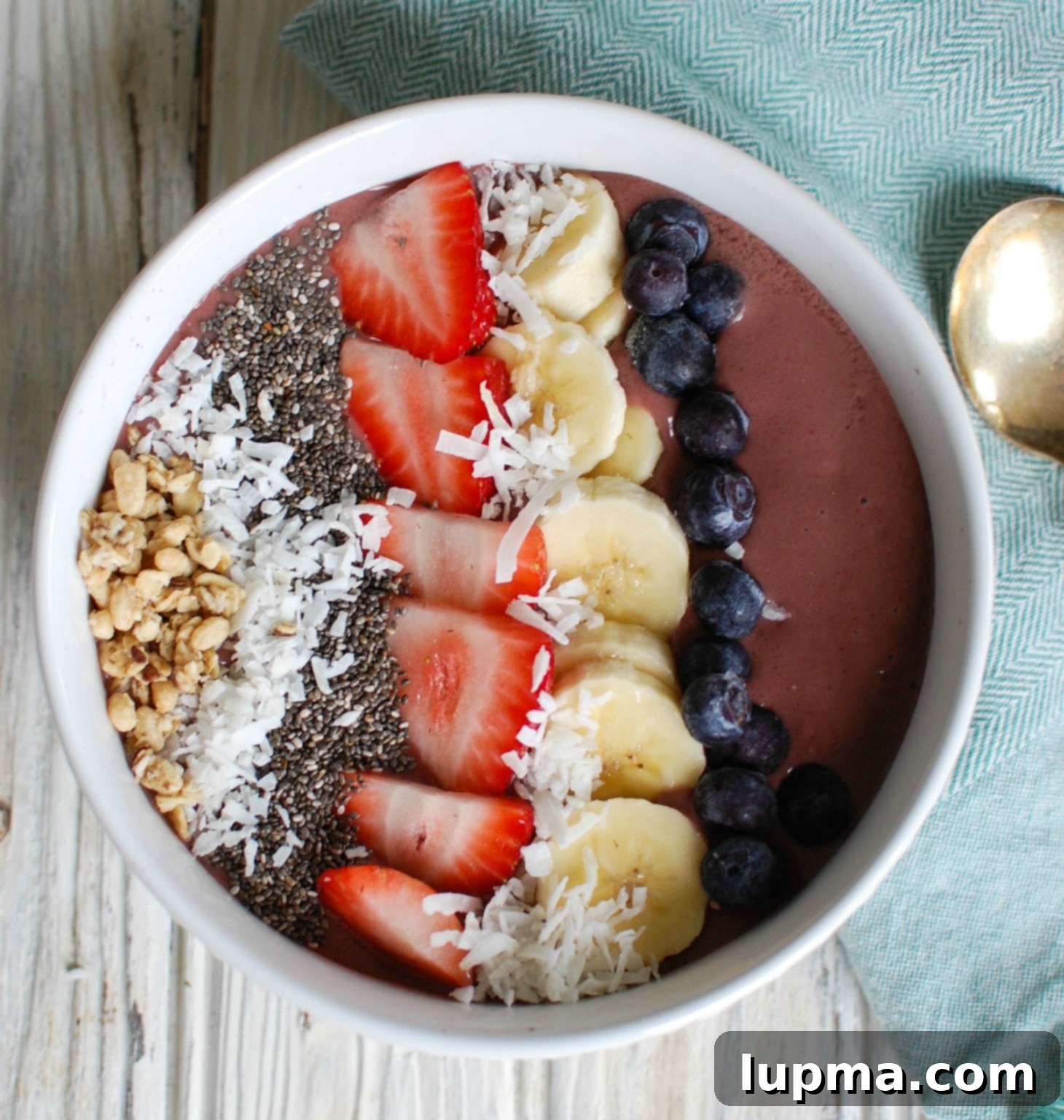 Vibrant Chia Seed Fruit Medley 11 Chia Seeds Fruit Bowl with a spoon and napkin, showcasing its vibrant colors and toppings.