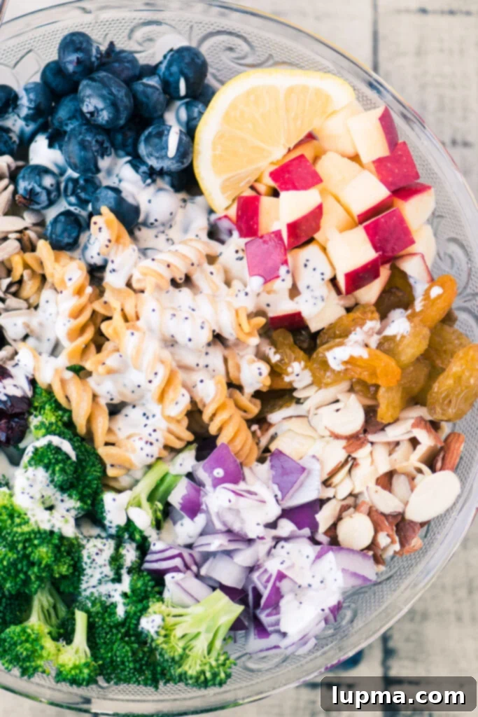 Cool Off with 13 Refreshing Summer Salads 15 A colorful tortellini salad featuring fresh strawberries, corn, and creamy avocado.