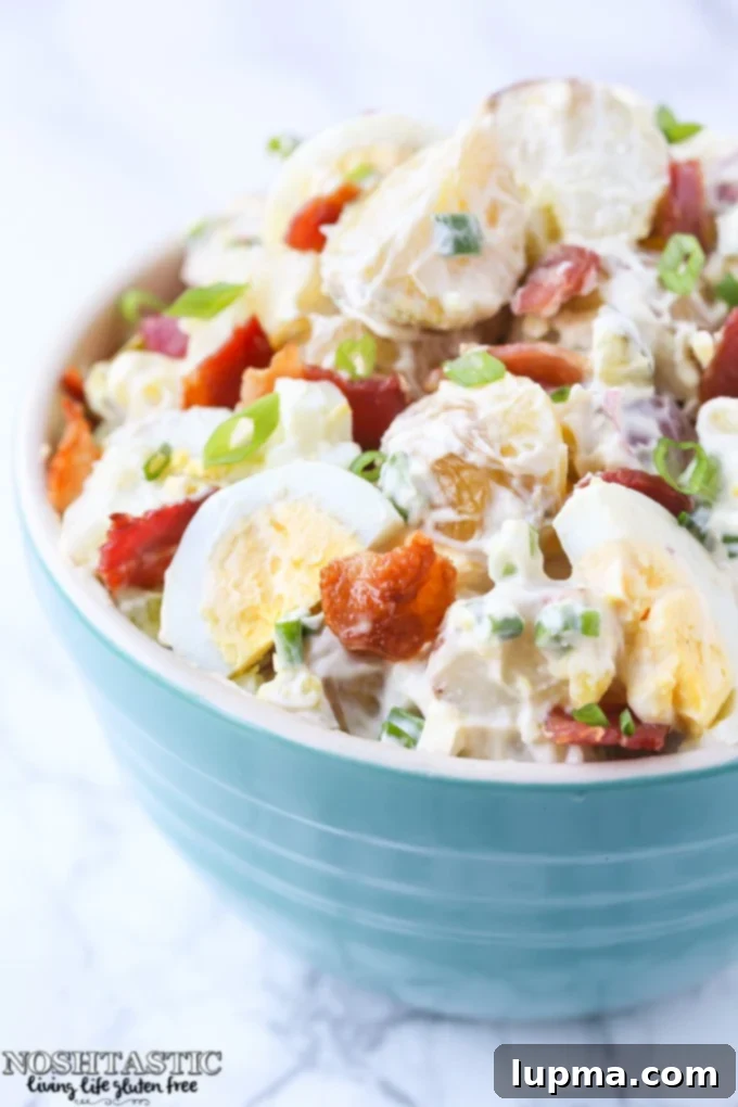 Cool Off with 13 Refreshing Summer Salads 7 A bowl of Garden Veggie Tortellini Pasta Salad with colorful vegetables.