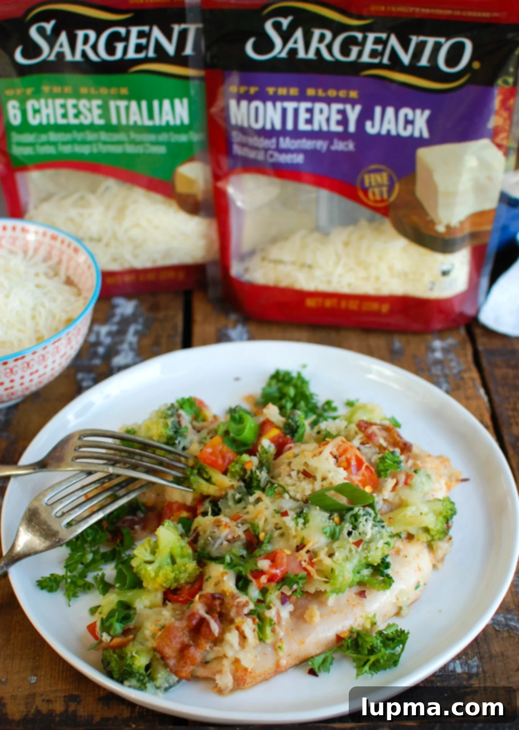 Cheesy Broccoli Chicken Bake 3 Close-up of Baked Broccoli Cheese Chicken in a casserole dish, highlighting the melted cheese, crispy panko, and tender ingredients, ready to be served as a wholesome family dinner.