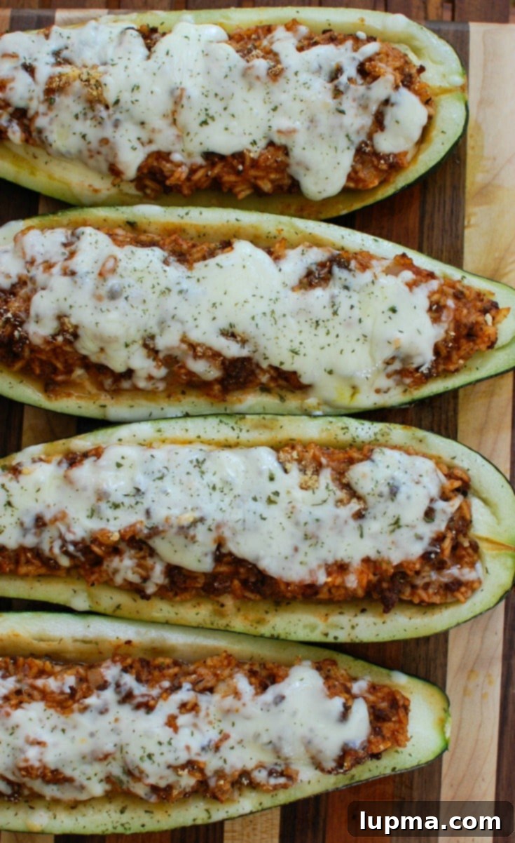 Cheesy Broccoli Chicken Bake 8 Delicious Mediterranean Zucchini Boats stuffed with ground meat, rice, and spices, topped with melted Sargento shredded cheese and fresh parsley, a perfect use for garden zucchini.