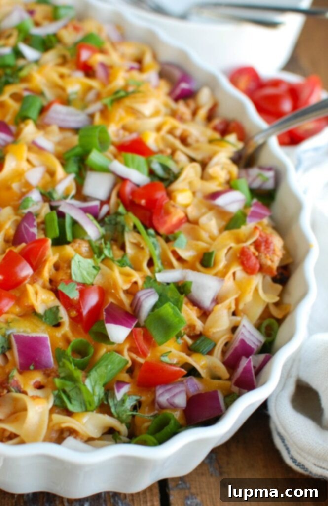 Easy Mexican Noodle Casserole makes weeknight meals easy, fun and festive with a colorful casserole packed with No Yolk Noodles, colorful vegetables, ground turkey, spices and cheese. This dish will quickly become a family favorite. 