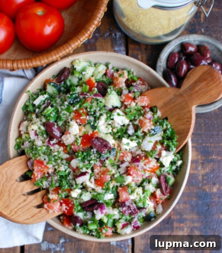 Aegean Tabbouleh 3 Greek Tabbouleh with serving spoons.