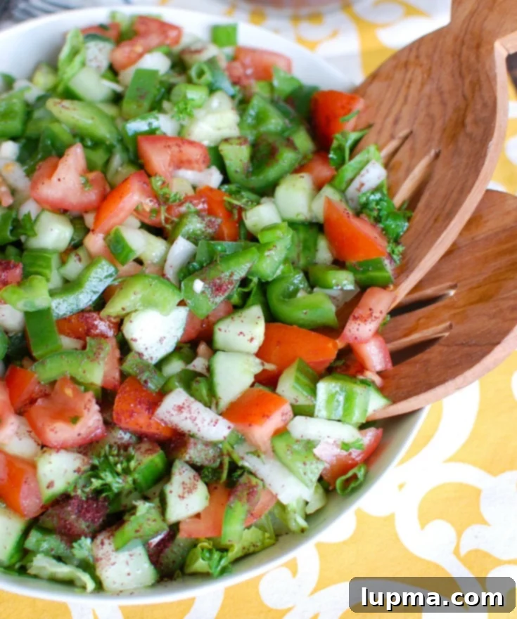 Fresh & Easy Lebanese Salad 4 Close-up of fresh chopped vegetables for Easy Lebanese Salad, including tomatoes, cucumbers, and parsley.