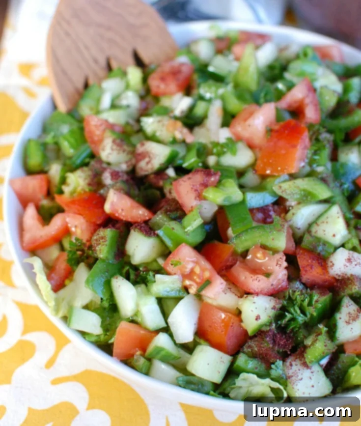 Fresh & Easy Lebanese Salad 5 Easy Lebanese Salad from a side view, showing layers of fresh chopped ingredients.