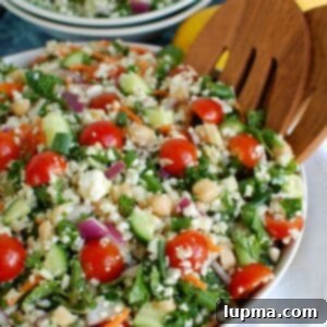 Mediterranean Roasted Cauliflower & Chickpea Salad 7 Mediterranean Chickpea Cauliflower Salad 1200 x 1200, a vibrant bowl of salad.