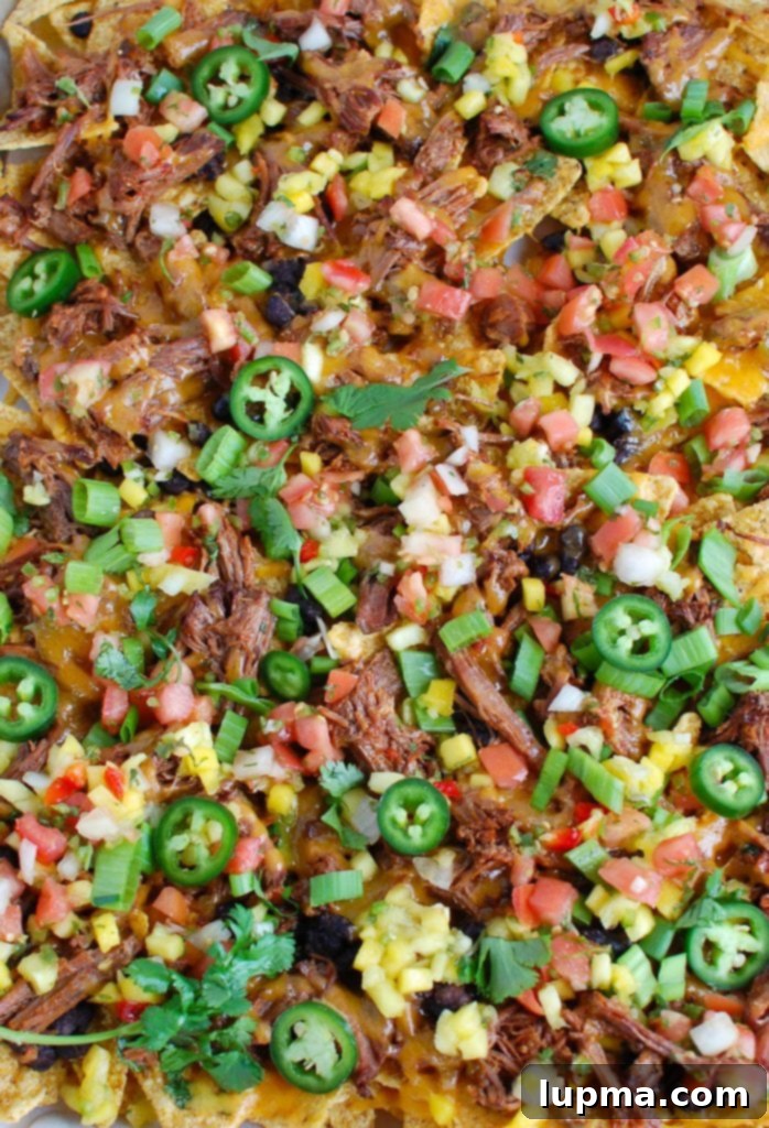 Ultimate Beef Nacho Feast 4 Beef Nachos on baking sheet