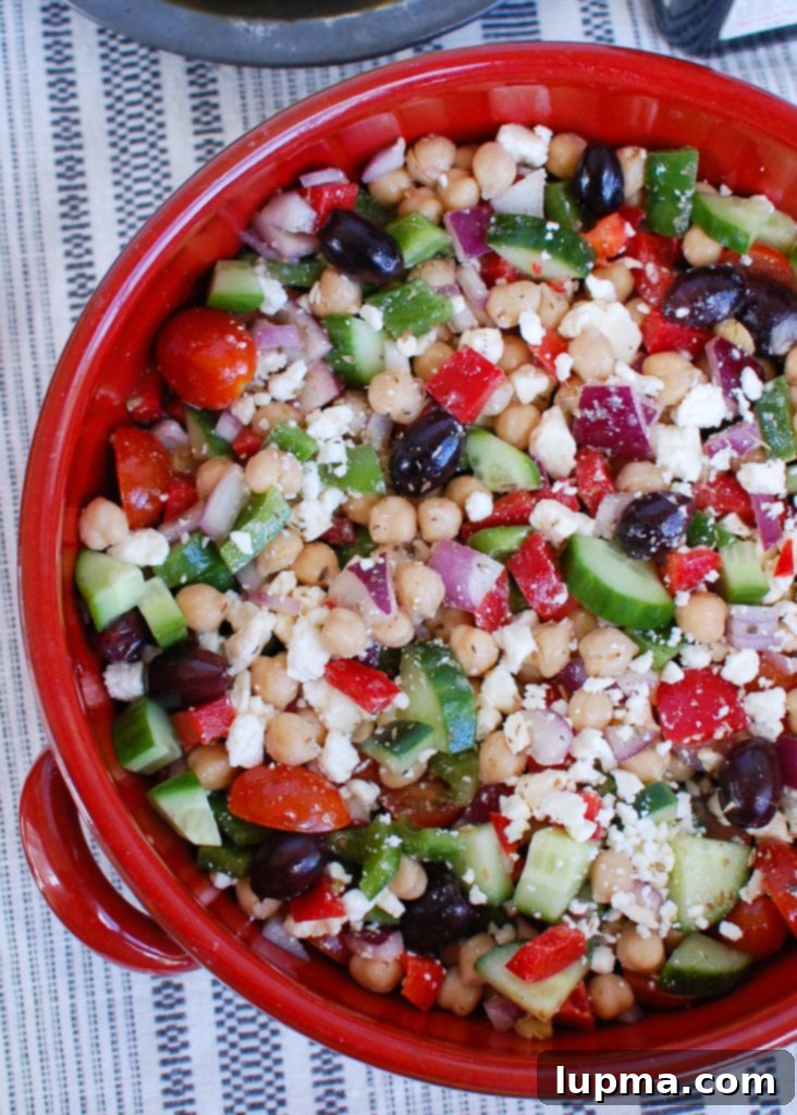 Zesty Mediterranean Chickpea Medley 4 Large bowl of freshly mixed Greek Chickpea Salad, showing diverse ingredients