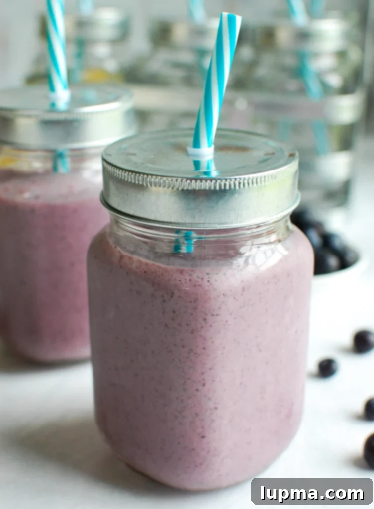 Blueberry Kale Power Blend 2 Blueberry Kale Smoothie with teal straw