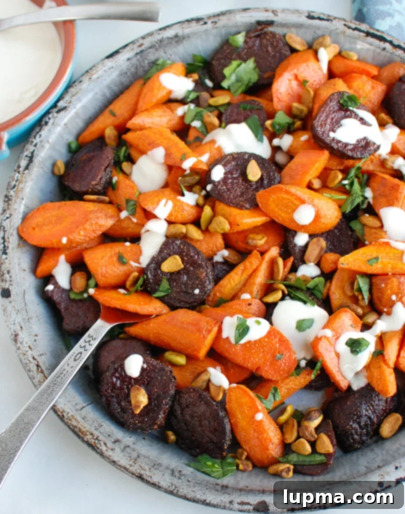 Caramelized Carrots and Beets with Creamy Tahini Drizzle 6 Roasted Carrots and Beets with Tahini with serving spoon