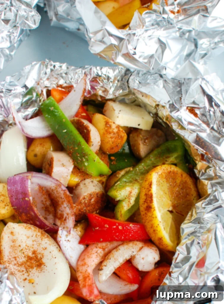 Sausage & Shrimp Foil Pack Dinners 2 Sausage and Shrimp Foil Packets in the packet, showing perfectly cooked ingredients