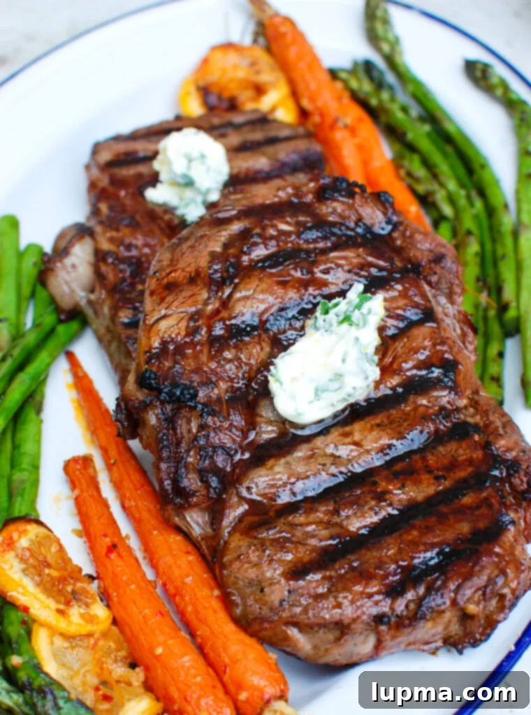 Zesty Lemon Garlic Butter Grilled Ribeye 5 Close-up of Lemon Garlic Butter Grilled Ribeye topped with melted butter and fresh herbs