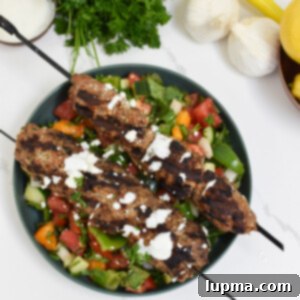 Turkish Kofta Recipe 10 Turkey Kofta Kebab Recipe on a salad.