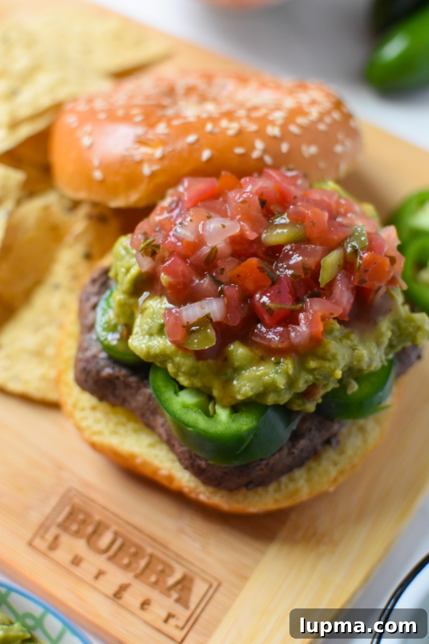 Southwest Sensation Burger 2 Tex Mex Burger with pico de gallo, ready to be served.