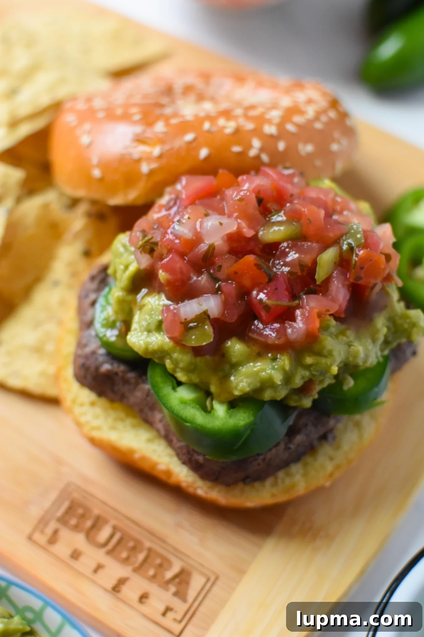Southwest Sensation Burger 5 Tex Mex Burger with guacamole served.