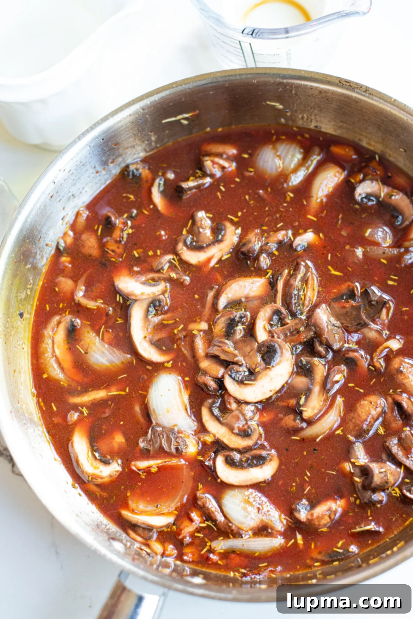 Hearty Mushroom Bourguignon 6 Mushroom Bourguignon mushrooms in pan.
