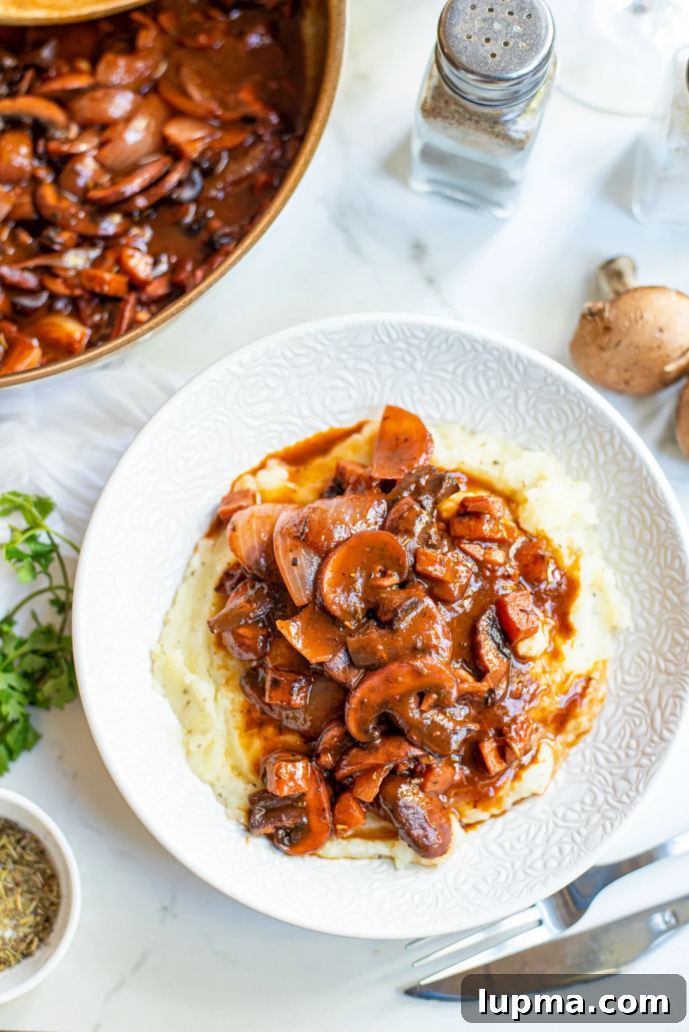 Hearty Mushroom Bourguignon 7 Mushroom Bourguignon in white plate.