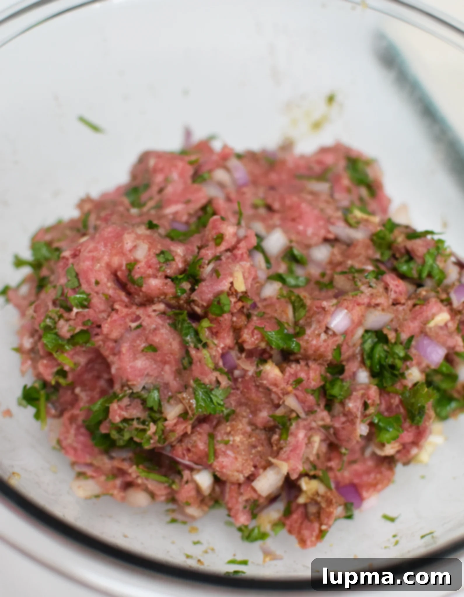 The perfectly blended Mediterranean Baked Beef Meatball mixture, ready for shaping.