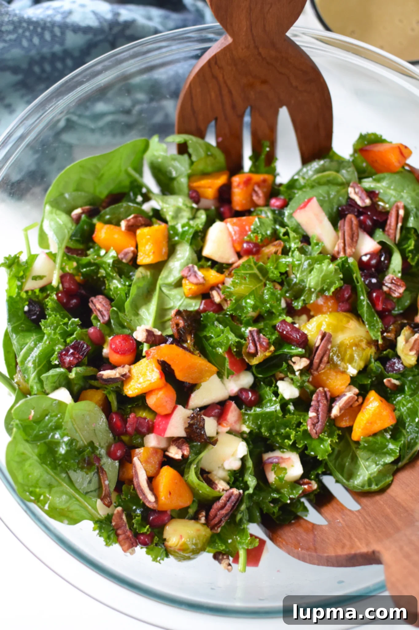 Autumn's Bounty Salad 4 A vibrant Fall Harvest Salad in a clear glass bowl, showing off the layers of fresh and roasted ingredients.