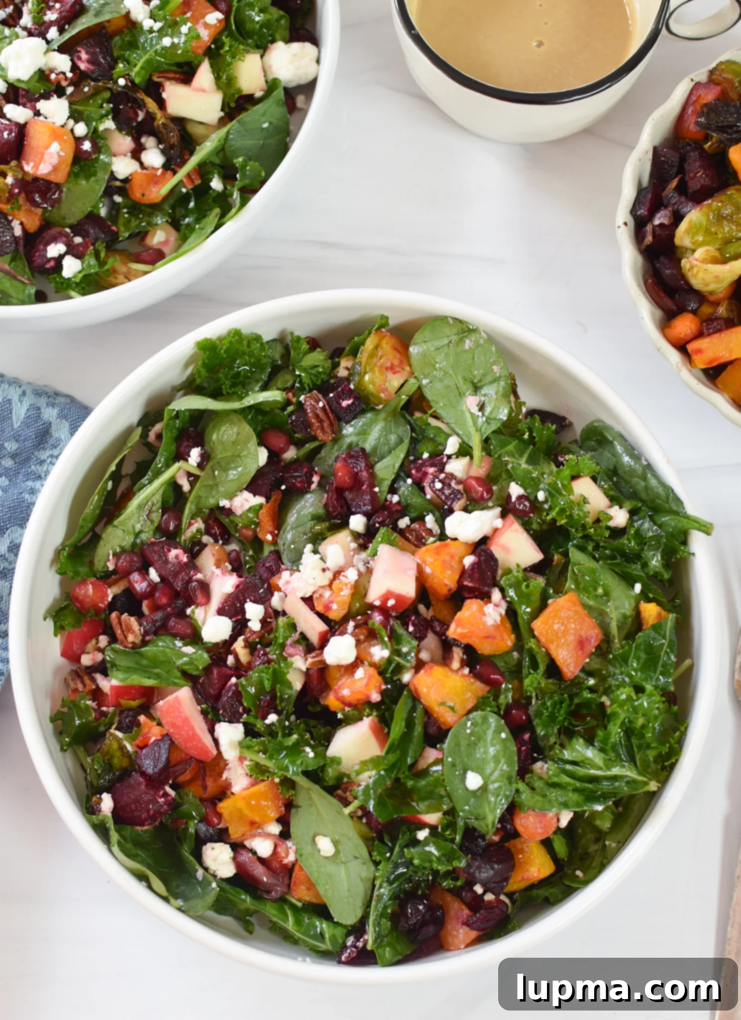 Autumn's Bounty Salad 5 A vibrant Fall Harvest Salad in a white bowl, ready to be served and enjoyed.