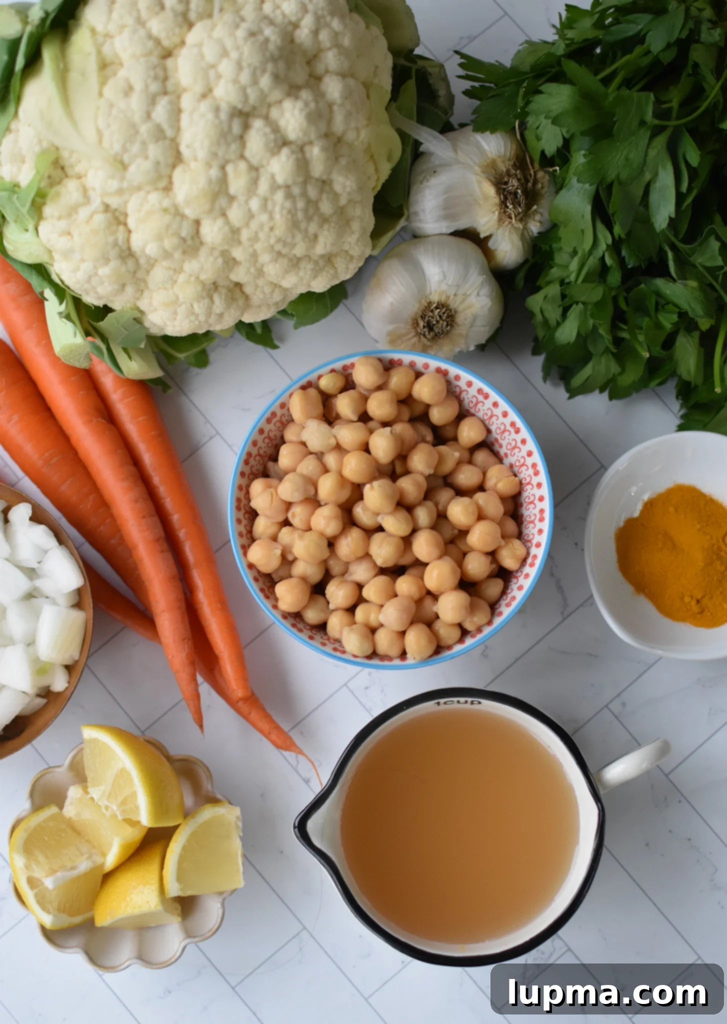 Velvet Cauliflower Puree 3 Fresh ingredients for Creamy Cauliflower Soup on a cutting board.