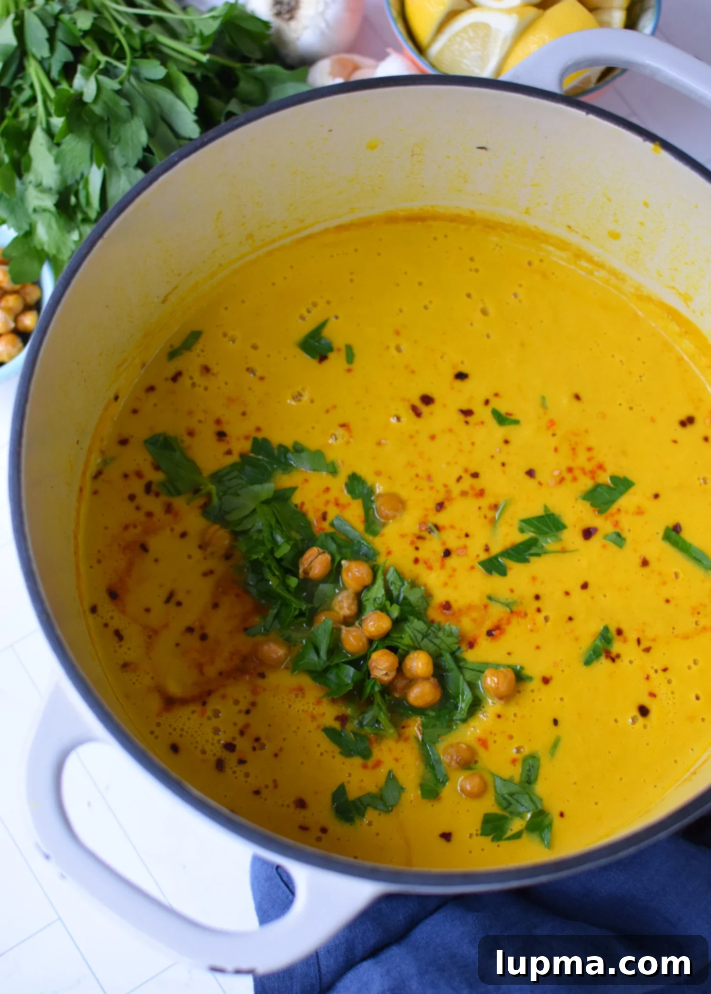 Velvet Cauliflower Puree 4 Creamy Cauliflower Soup simmering in a large pot.