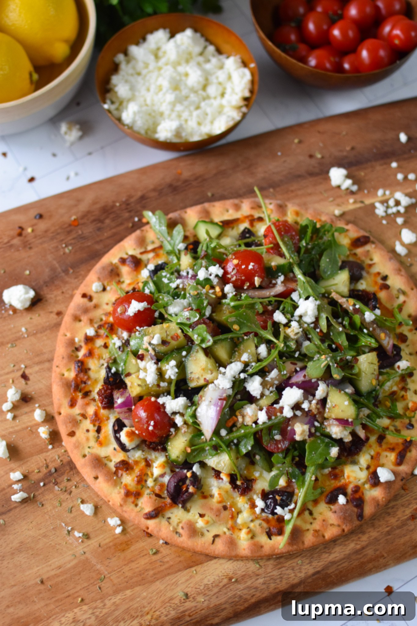 Hellenic Herb & Feta Pizza 2 Greek Pizza with arugula.
