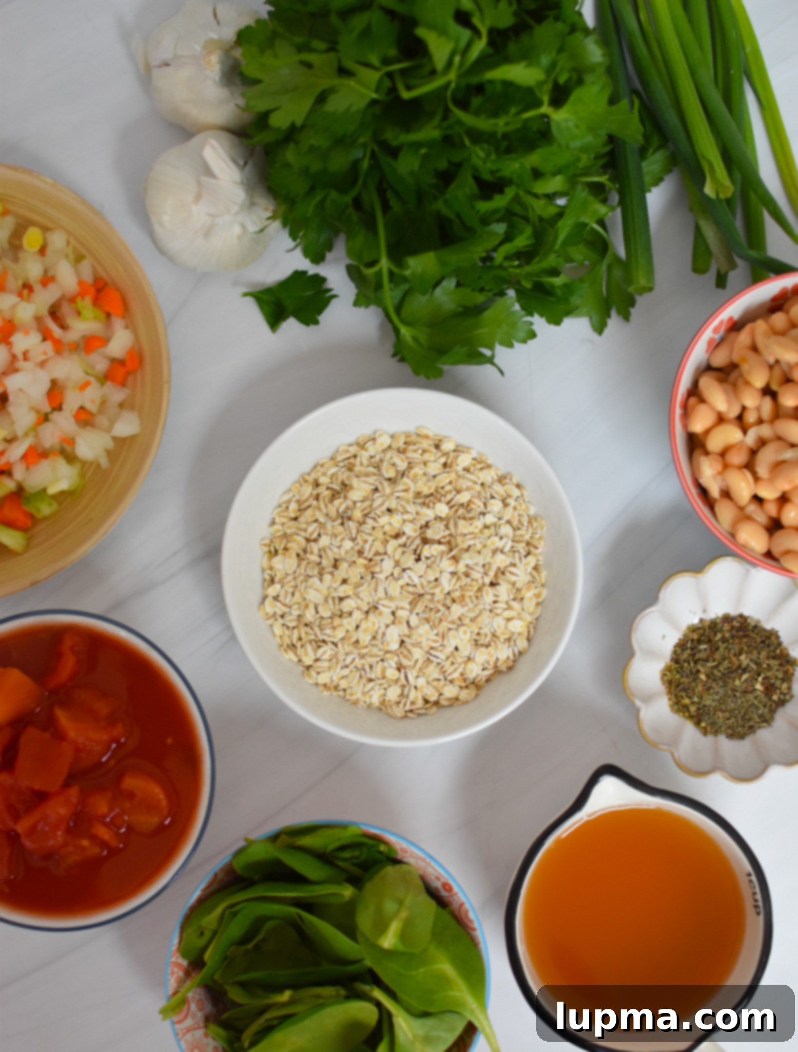 Hearty Vegetable and Barley Soup 4 A collection of fresh ingredients laid out, including vegetables, barley, beans, and spices, ready for Vegetable Barley Soup.