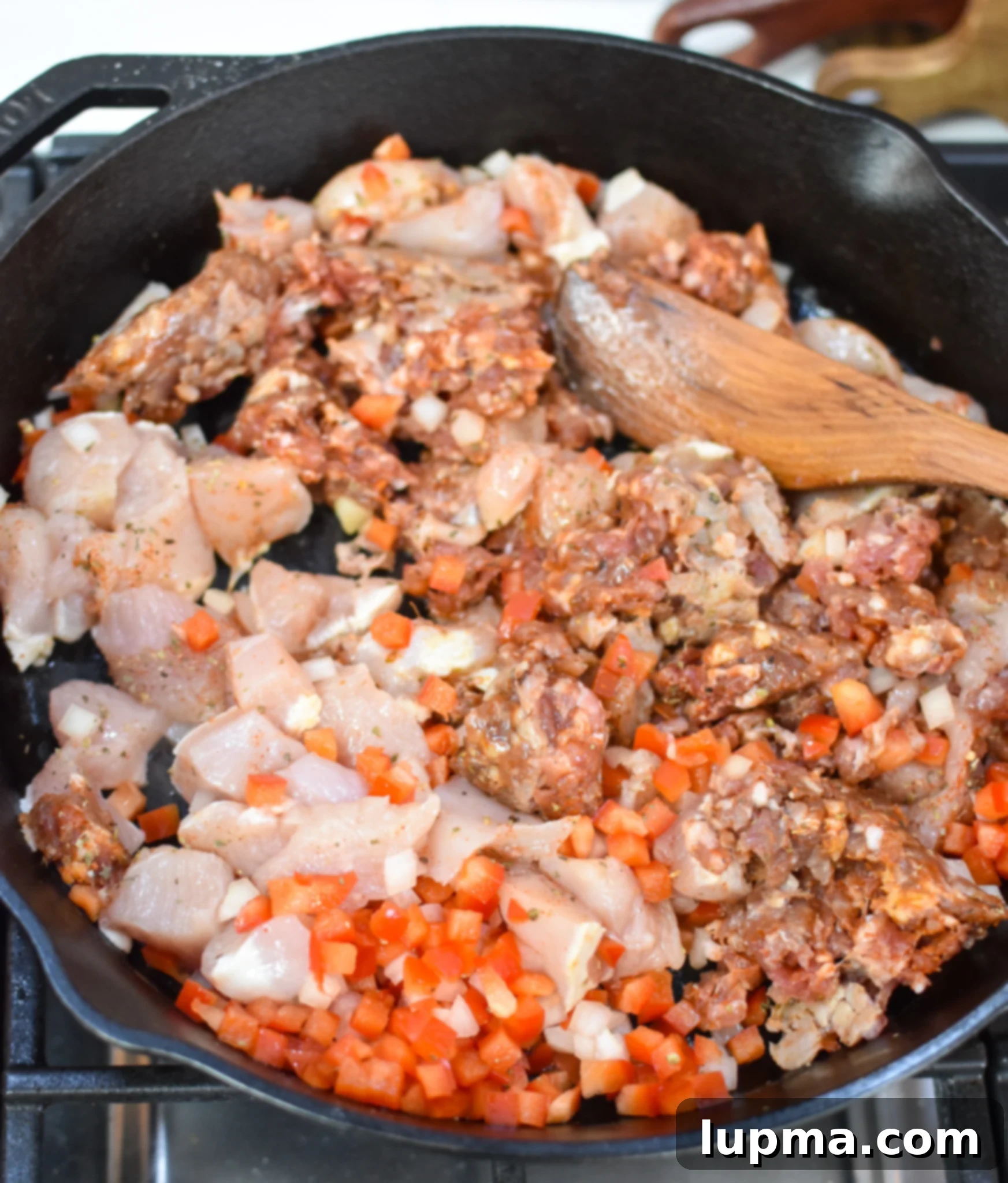 The Ultimate Creamy Chicken & Chorizo Pasta 6 Creamy Chicken and Chorizo Pasta Recipe in a cast iron skillet.