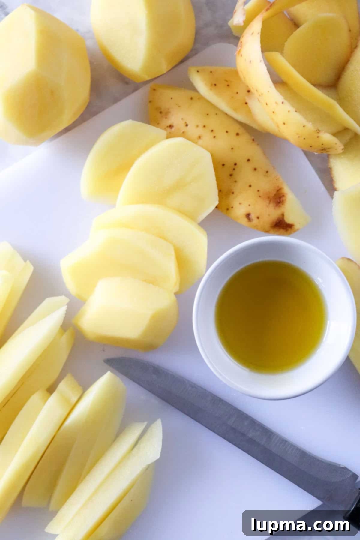 Crispy Air Fryer French Fries: The Perfect Recipe 6 Air Fryer French Fries Recipe fries being cut
