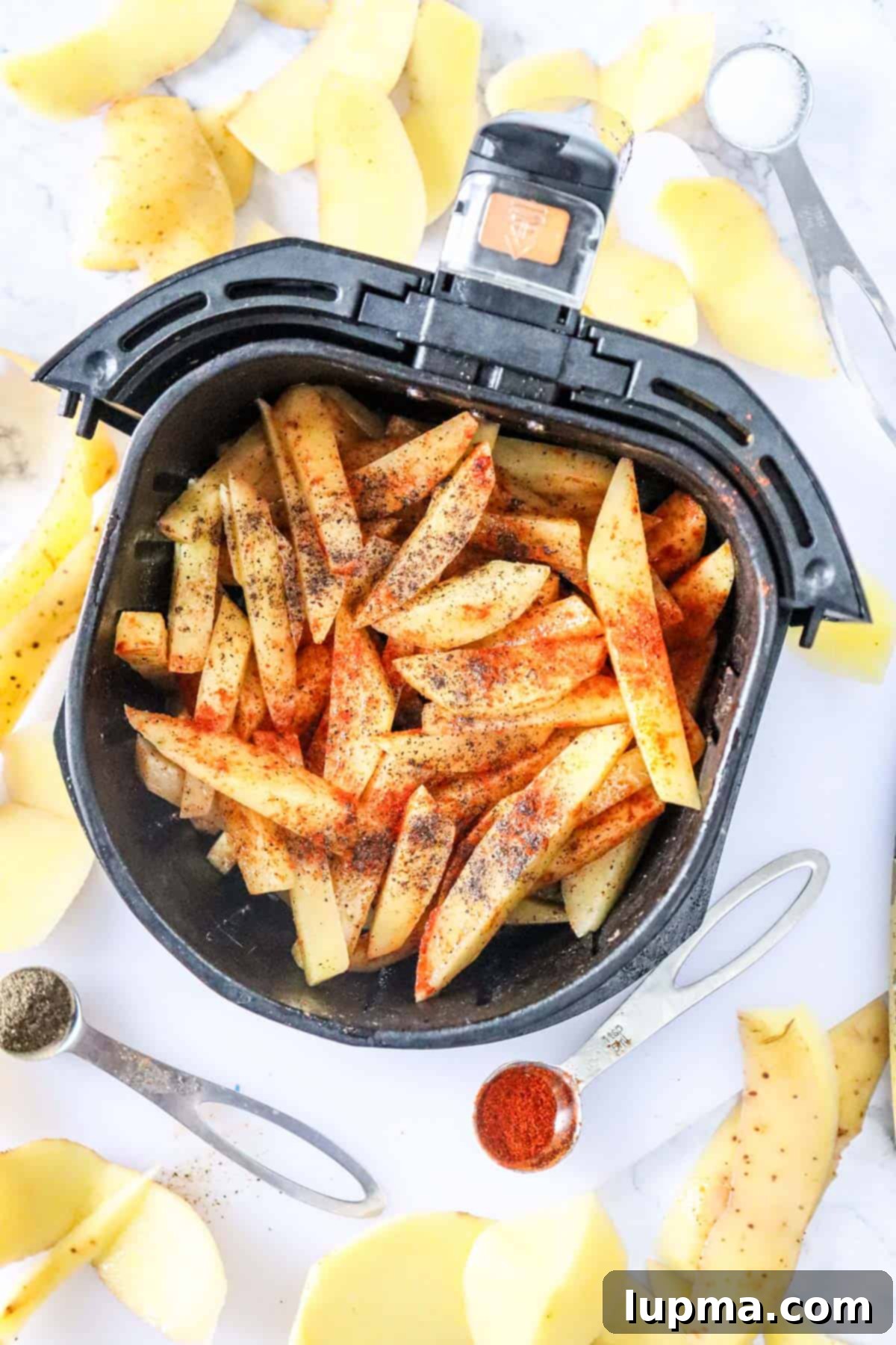 Crispy Air Fryer French Fries: The Perfect Recipe 8 Air Fryer French Fries Recipe in an air fryer basket