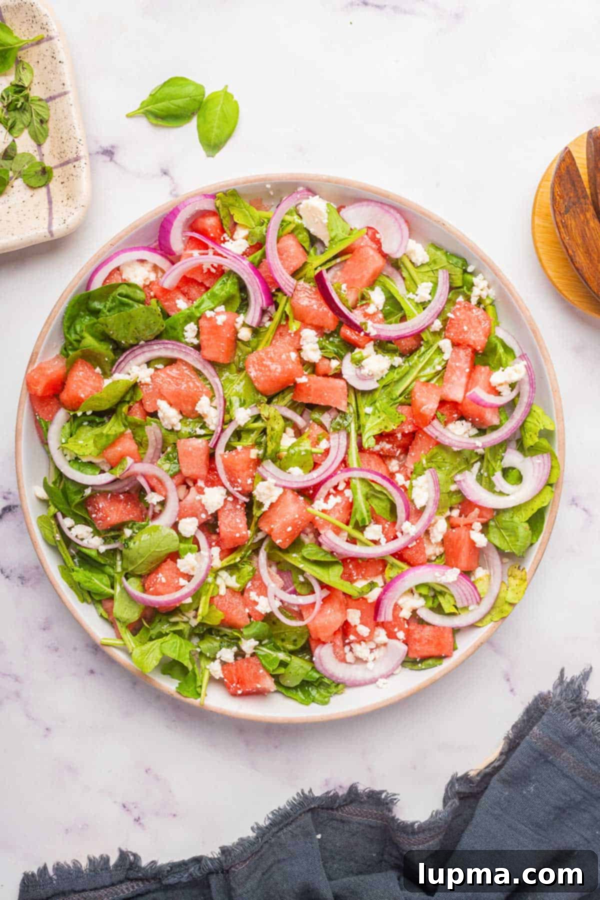 Refreshing Watermelon Arugula Medley 2 Watermelon Arugula Salad on a white plate
