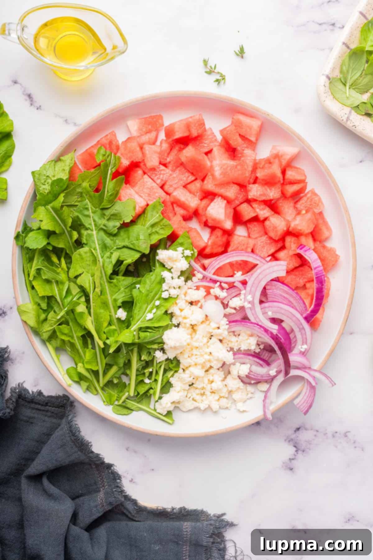 Refreshing Watermelon Arugula Medley 6 Watermelon Arugula Salad ingredients on a plate