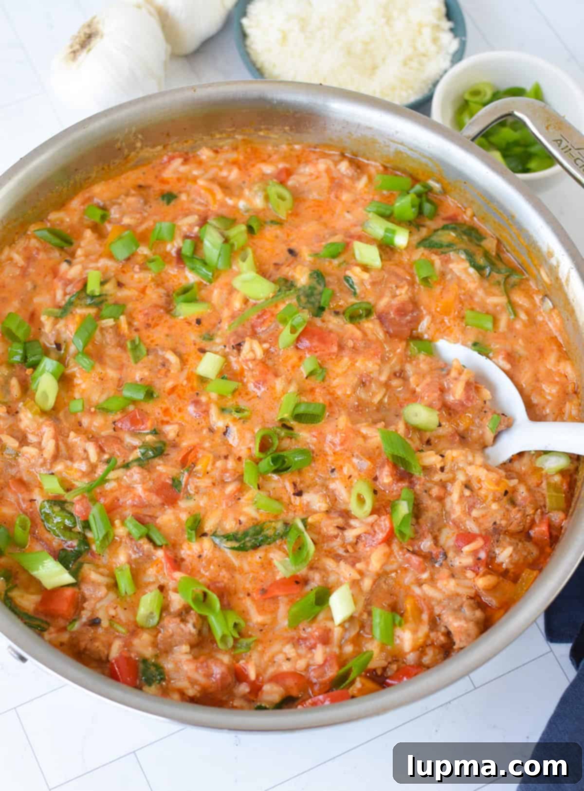 Hearty Creamy Cajun Sausage Rice Skillet 5 Creamy Cajun Sausage Rice Skillet with green onions