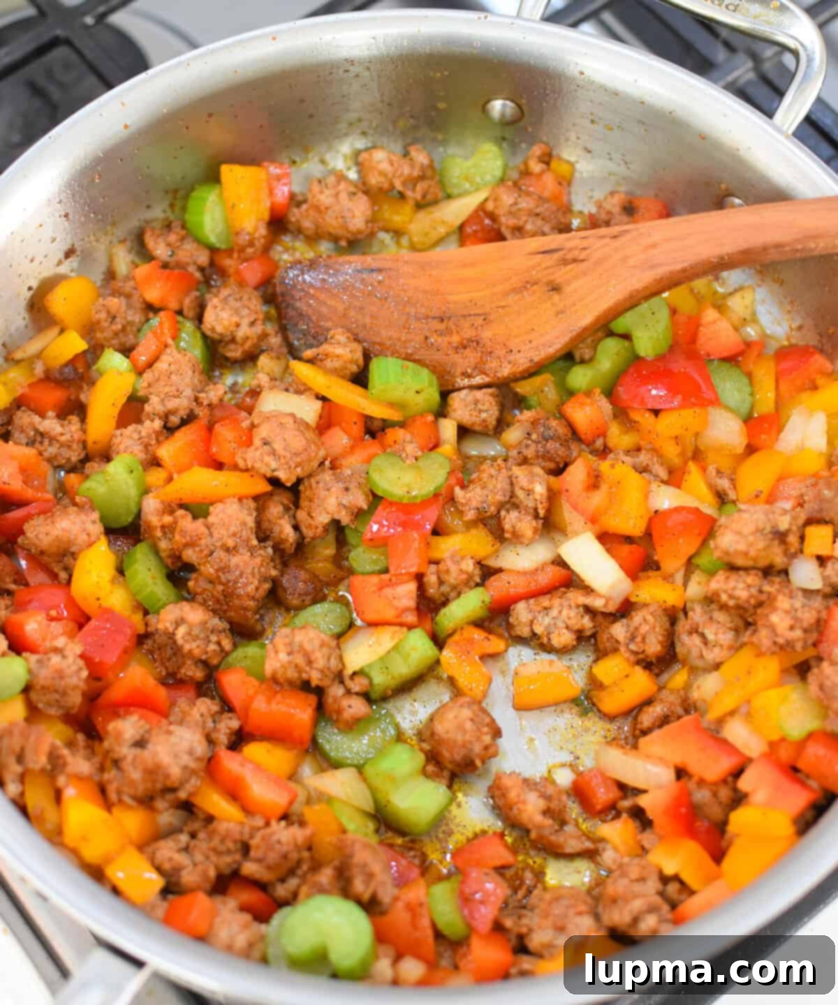 Hearty Creamy Cajun Sausage Rice Skillet 6 Creamy Cajun Sausage Rice Skillet sausage and vegetables in a skillet