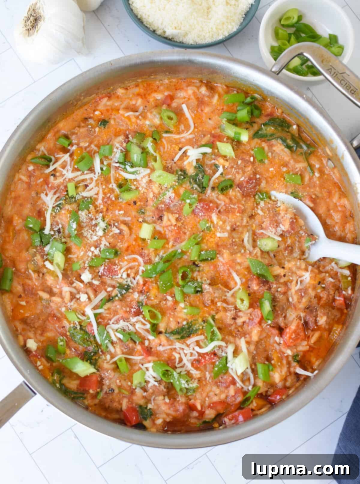 Hearty Creamy Cajun Sausage Rice Skillet 9 Creamy Cajun Sausage Rice Skillet with cream in it