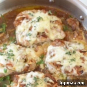 Smothered French Onion Pork Chops 11 French Onion Pork Chops, top down view in skillet
