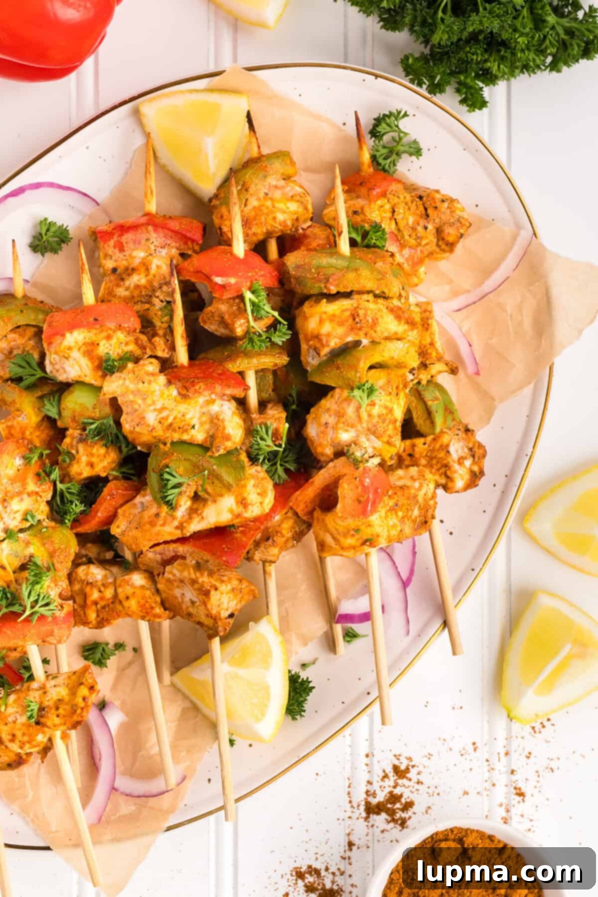 Smoky Chicken Tikka Skewers 2 Chicken Tikka Kebabs on plate
