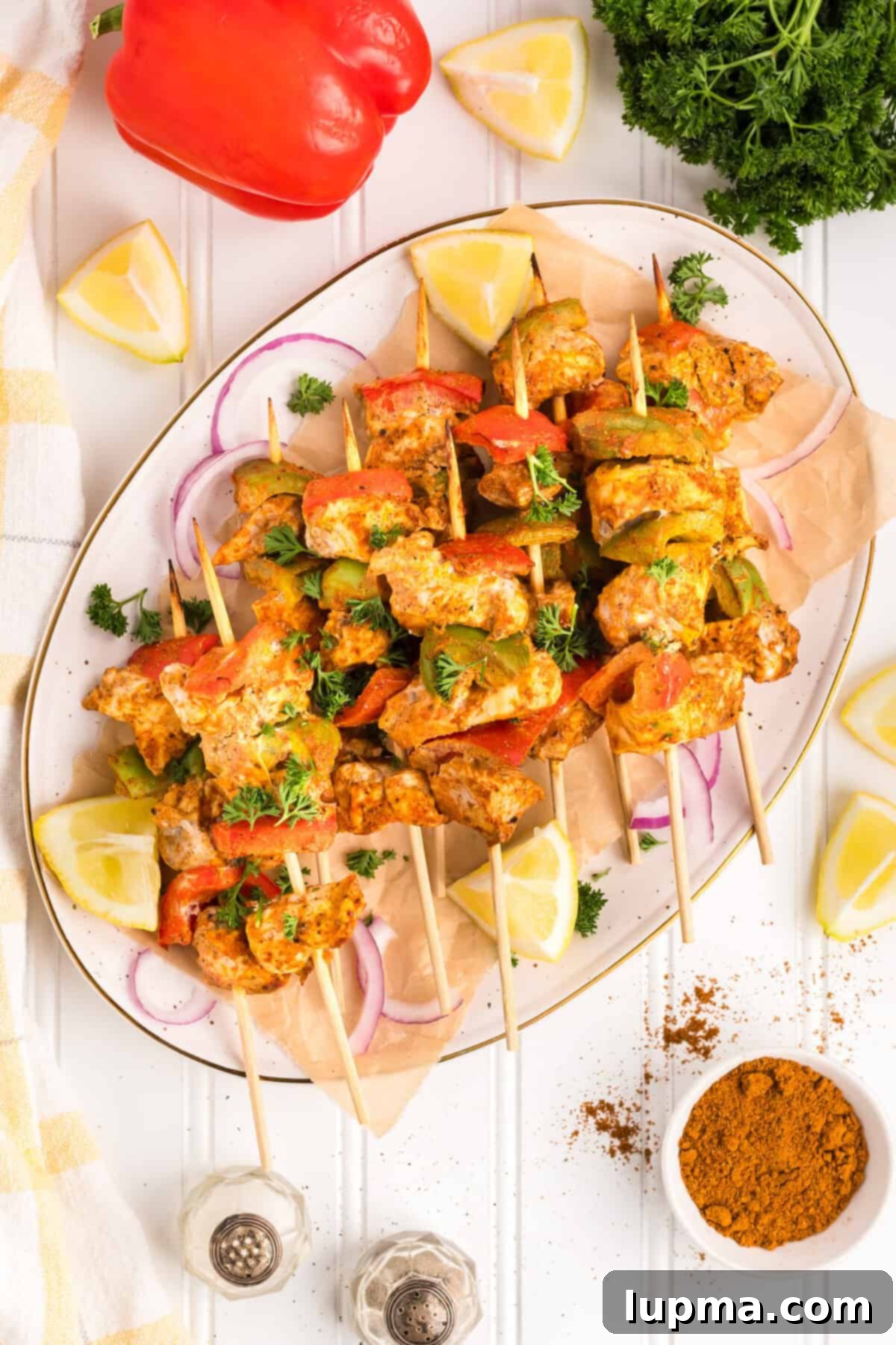 Smoky Chicken Tikka Skewers 10 Chicken Tikka Kebabs on a white plate