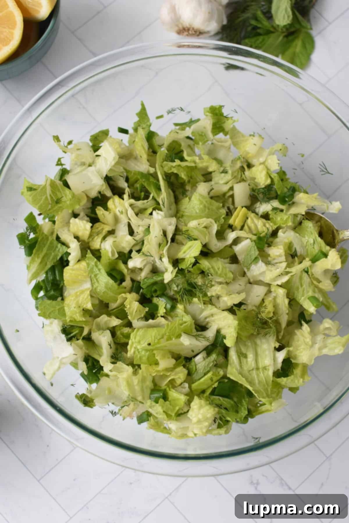 Maroulosalata Crisp Greek Lettuce Salad 8 Maroulosalata in a clear bowl