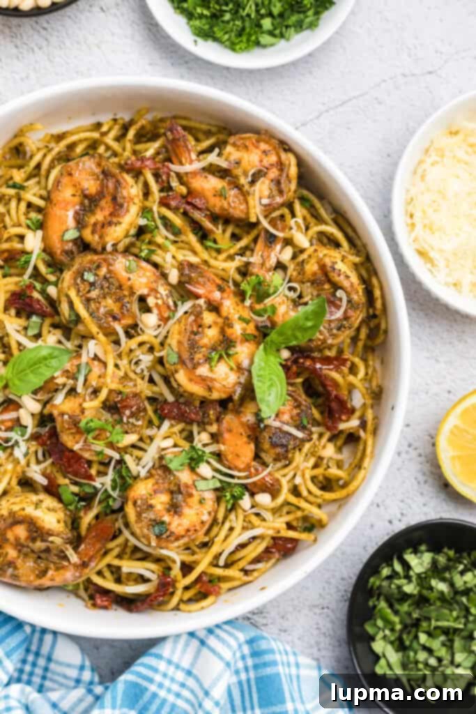 Vibrant Shrimp Pesto Pasta 5 Shrimp Pesto Pasta with fresh basil leaves